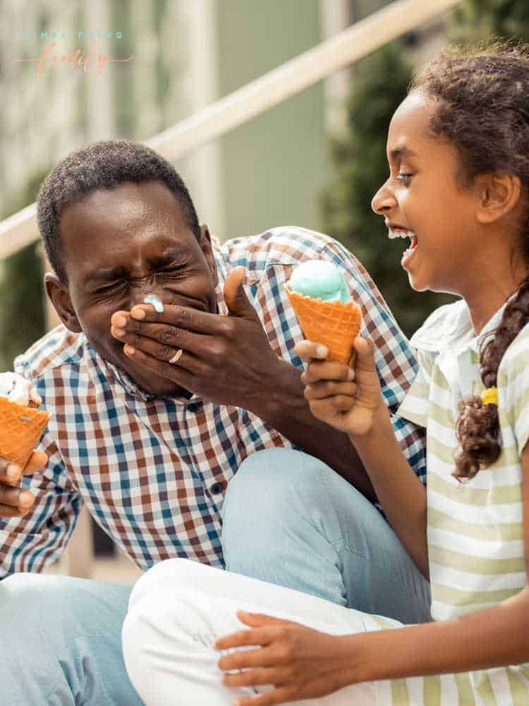 Summer Activities for Families - dad and daughter eating ice cream and laughing