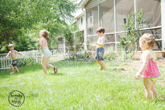 Summer in Motion Playing in the Sprinkler