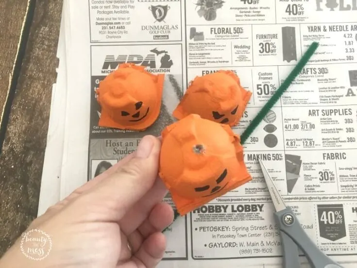 -When the pumpkins are dry, use the craft scissors to gently poke a hole in the top of each pumpkin