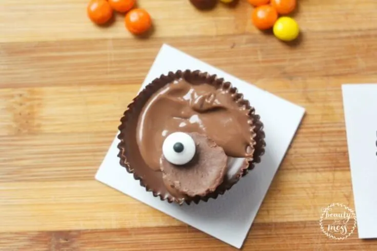 attach-the-candy-eyes-to-the-top-half-of-the-reeses-mini-using-a-touch-of-melted-chocolate