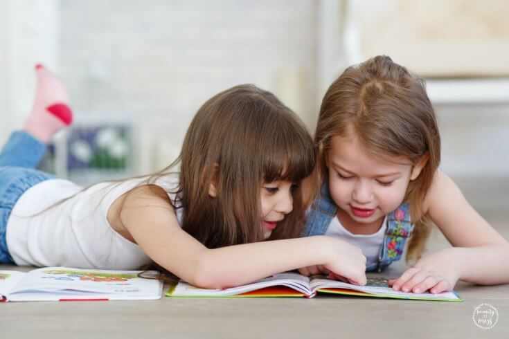 girls reading on floor - Reading Readiness Skills