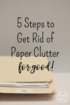 Folder holding paper. 5 Steps to get rid of paper clutter for good.