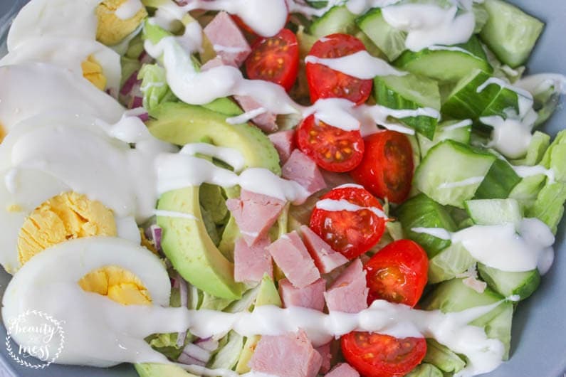 Delicious Cobb Salad with hard boiled eggs, ham, tomatoes, and lettuce
