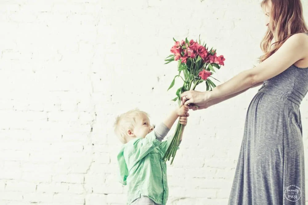 Son Giving Mom Flowers