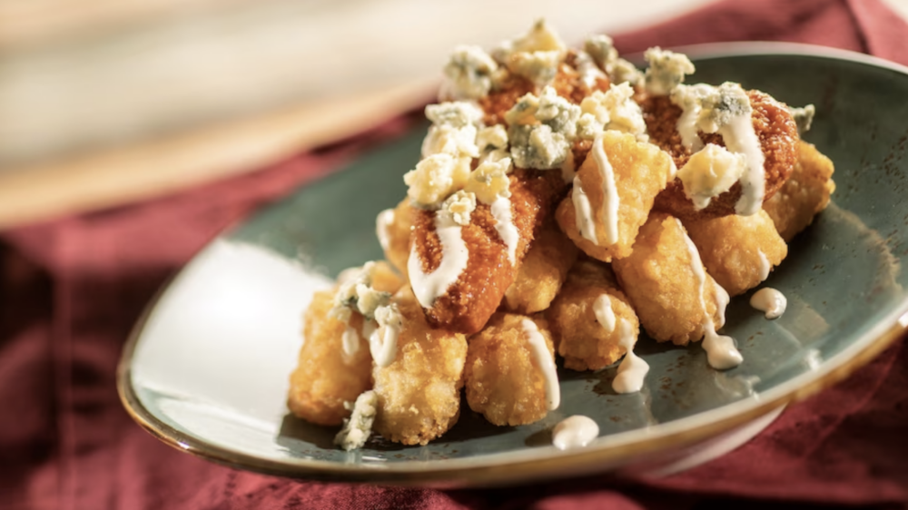 Plant-Based Buffalo Chicken Tender Poutine on Crispy Potato Barrels with Plant-Based Ranch and Blue Cheese Crumbles